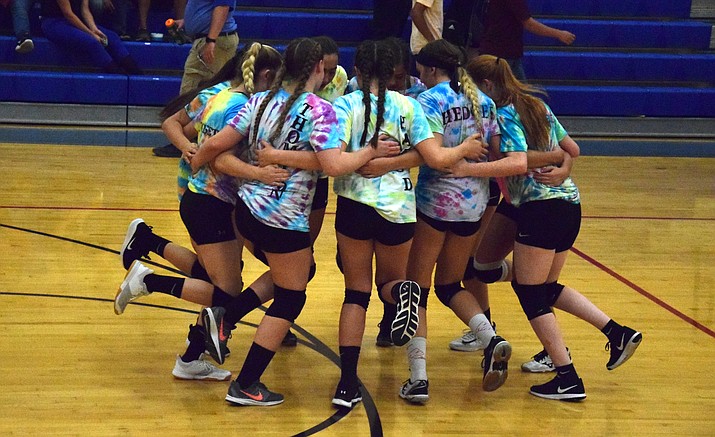 Camp Verde volleyball players cheer and dance together before a scrimmage on Thursday at home. VVN/James Kelley