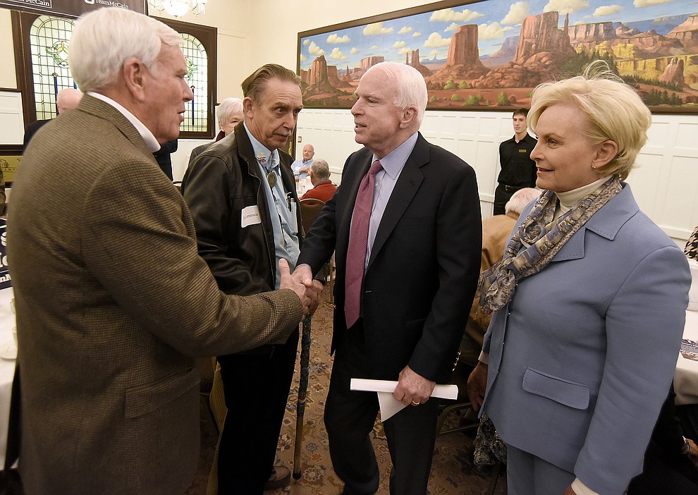 Sen. John McCain shakes Prescott Mayor Harry Oberg's hand while Cindy McCain and Councilman Jim Lamerson look on Tuesday morning March 29, 2016 at the Hassayampa Inn while hosting a coffee reception in Prescott. (Matt Hinshaw/The Daily Courier)