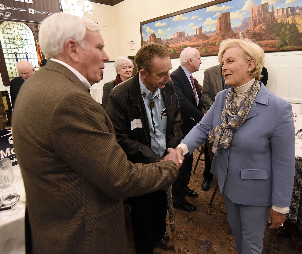 Cindy McCain shakes Prescott Mayor Harry Oberg's hand while Councilman Jim Lamerson looks on and her husband Sen. John McCain stands in the background Tuesday morning March 29, 2016 at the Hassayampa Inn while hosting a coffee reception in Prescott. (Matt Hinshaw/The Daily Courier)