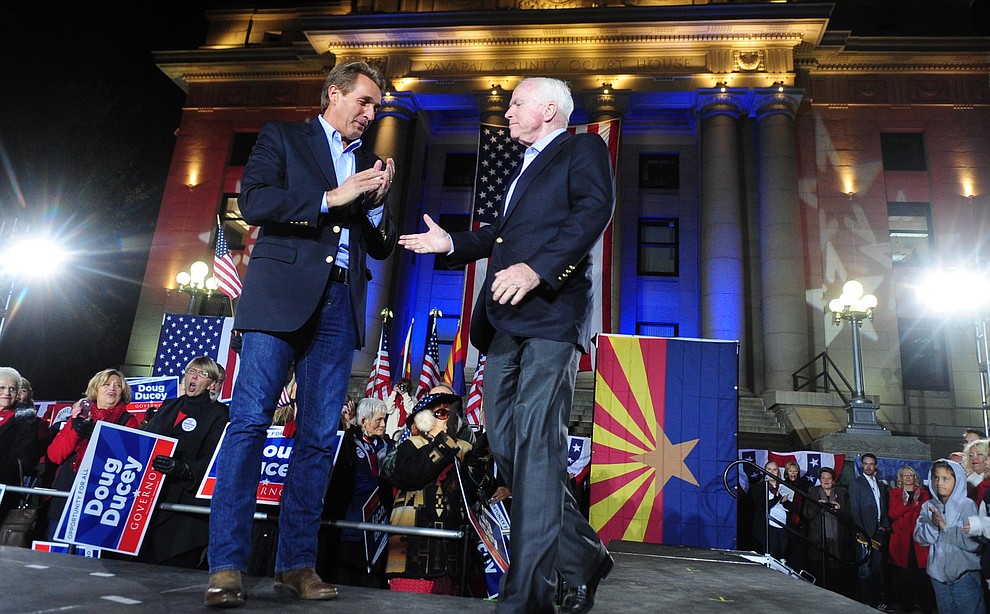 Prescott - November 3, 2014.Les Stukenberg/The Daily Courier.United Sates Senators Jeff Flake and John McCain shake hands during the Republican Party Victory Rally on the Yavapai County Courthouse Plaza Monday night.