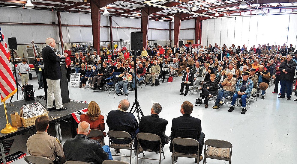 Prescott 10-27-12.Matt Hinshaw/The Daily Courier.U.S. Senator John McCain addresses a hanger full of members of public endorsing Jeff Flake, the Republican candidate for Arizona Senator Saturday morning at Legend Aviation at the Prescott Airport.