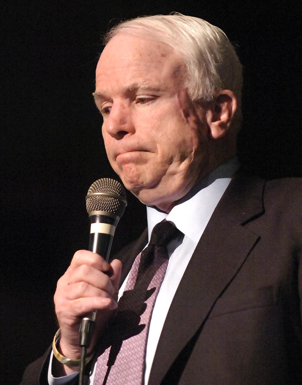 Prescott July 5 2006.Courier/Jo. L. Keener.Arizona Senator John McCain pauses as he talks to area residents Wednesday evening during a town hall meeting at Prescott High School. McCain discussed a number of issues including immigration and the Korean Missle crisis.