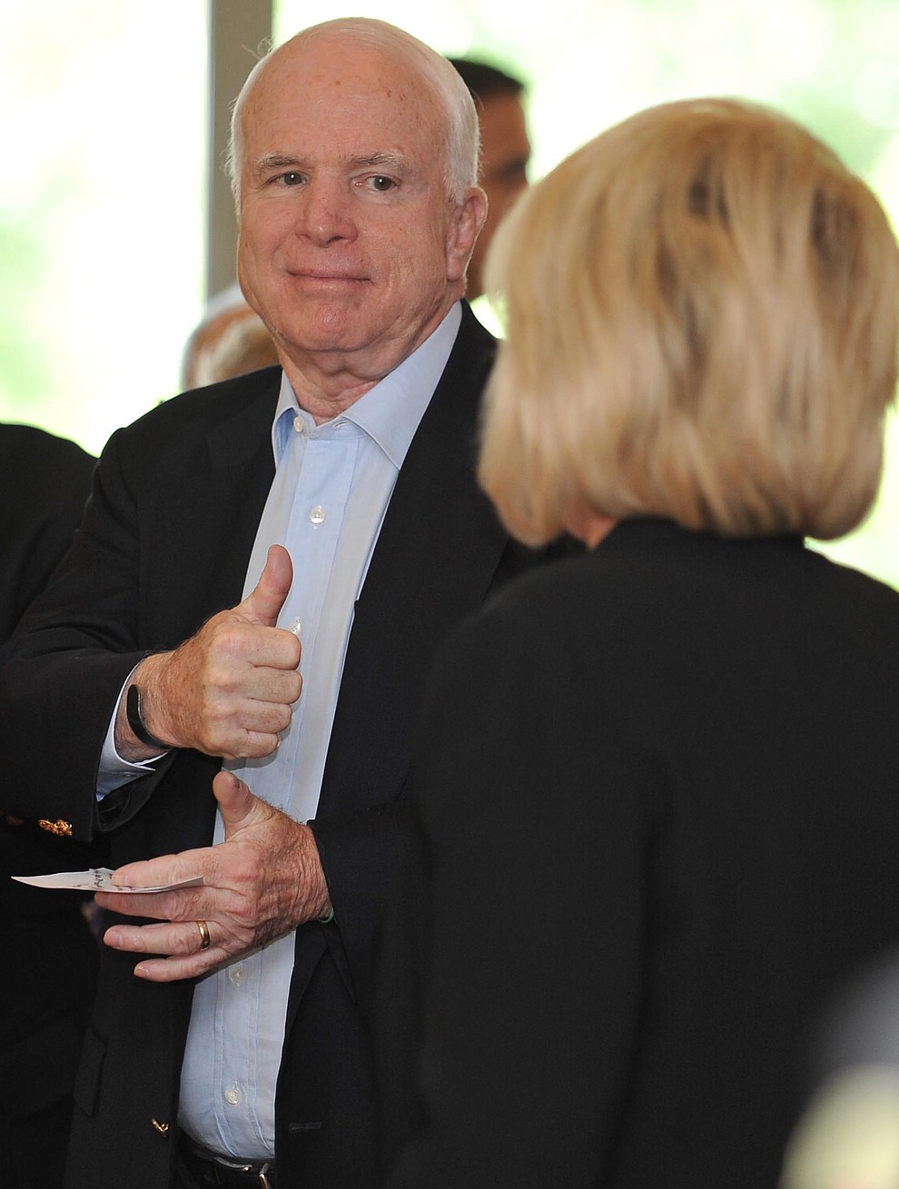 Prescott Valley- August 27, 2010.Les Stukenberg/The Daily Courier.Arizona Senator John McCain gives the thumbs up to Arizona Governor Jan Brewer after her opening remarks at the Yavapai Business Leaders monthly coffee at the Stoneridge Golf Clubhouse Friday morning.