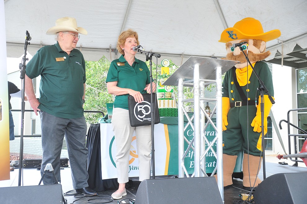 Board Chair Ray Sigafoos, President Penny Wills and the new mascot hit the stage as Yavapai College celebrates their 50th anniversary at the Prescott campus Saturday, August 25, 2018. (Les Stukenberg/Courier)