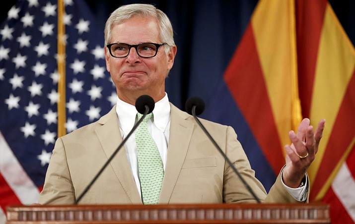 Rick Davis, spokesperson for Sen. John McCain's family, reacts as he speaks to the media during a news conference Monday, Aug. 27, 2018, in Phoenix. Davis discussed the memorial arraignments for McCain, the war hero who became the GOP's standard-bearer in the 2008 election, died at the age of 81, on Aug. 25, after battling brain cancer. (Matt York/AP Photo)