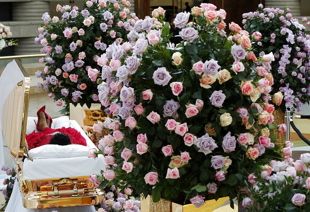 Aretha Franklin lies in her casket at Charles H. Wright Museum of African American History during a public visitation in Detroit, Tuesday, Aug. 28, 2018. Franklin died Aug. 16, 2018, of pancreatic cancer at the age of 76. (AP Photo/Paul Sancya, Pool)