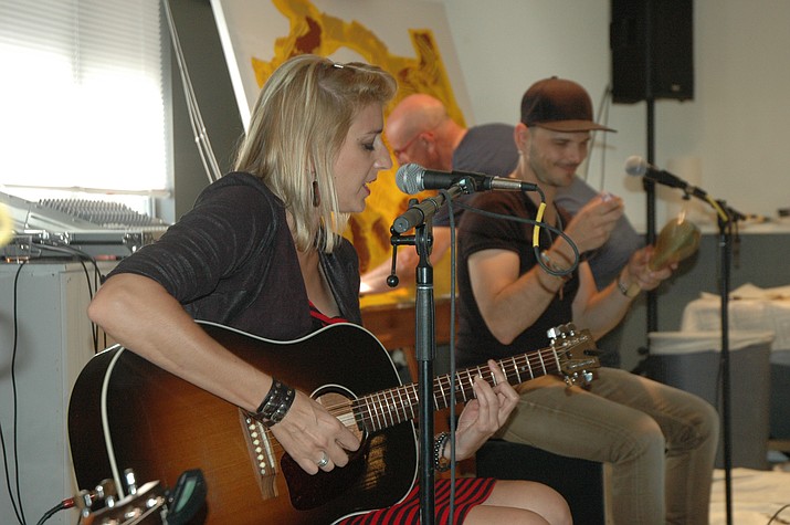 Gaelle Buswel and Steven Belmonte perform while Yves Cairoli creates an action painting at Mountain Artists Guild’s “The French Connection” show during “The French Connection: Up Close and Personal” event, which officially kicked off the Voila Tour Tuesday, Aug. 28, 2018. (Jason Wheeler/Courier)