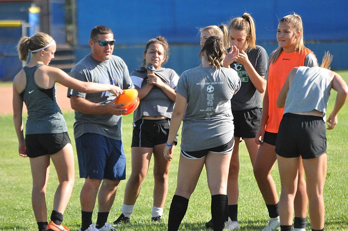 Chino Valley girls soccer head coach Allen Foster talks with a few players during practice Aug. 15, 2018, in Chino Valley. (Doug Cook/Courier)