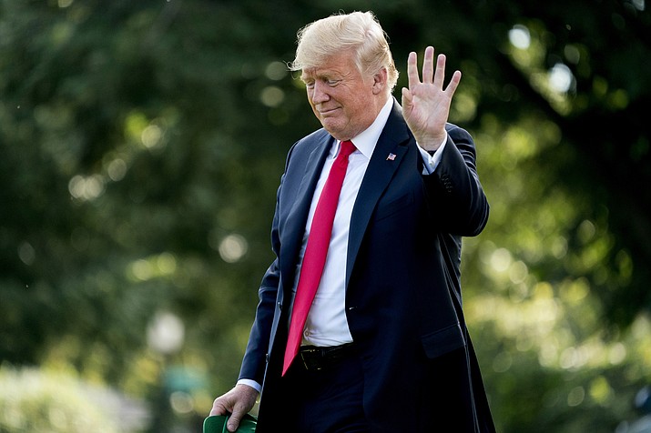 President Donald Trump waves to members of the media as he walks towards Marine One at the White House in Washington, Thursday, Aug. 30, 2018, for a short trip to Andrews Air Force Base, Md., and then on to Evansville, Ind., for a rally. (Andrew Harnik/AP Photo)