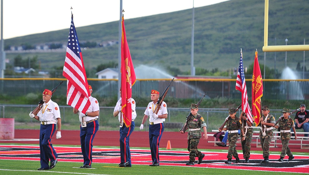 A Marine Corps and Young Marine color guard present the colors before Bradshaw Mountain take on the Youngker Roughriders in their home opener Friday, August 31, 2018 in Prescott Valley. (Les Stukenberg/Courier)