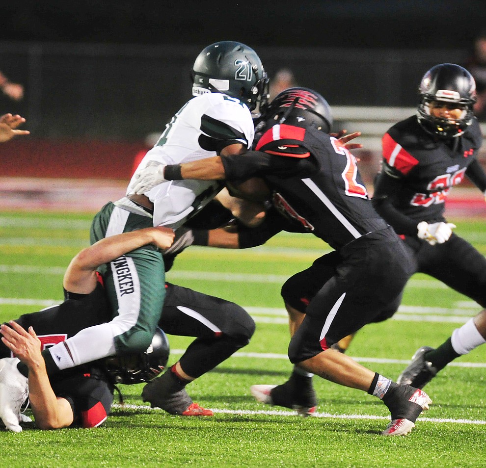 Bradshaw Mountain's Bobby Jones (27) makes a tackle as the Bears take on the Youngker Roughriders in their home opener Friday, August 31, 2018 in Prescott Valley. (Les Stukenberg/Courier)