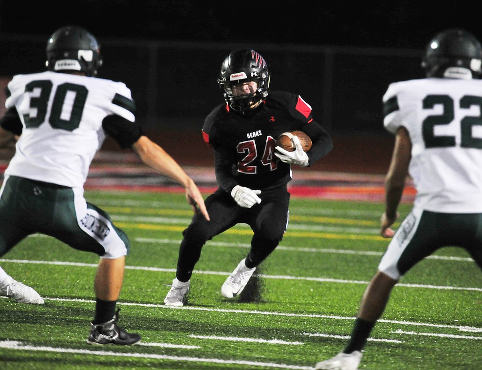 Bradshaw Mountain's Victor Arenas (24) looks for running room as the Bears take on the Youngker Roughriders in their home opener Friday, August 31, 2018 in Prescott Valley. (Les Stukenberg/Courier)