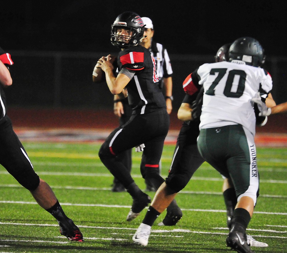 Bradshaw Mountain's Austin Gonzales (13) looks to pass as the Bears take on the Youngker Roughriders in their home opener Friday, August 31, 2018 in Prescott Valley. (Les Stukenberg/Courier)