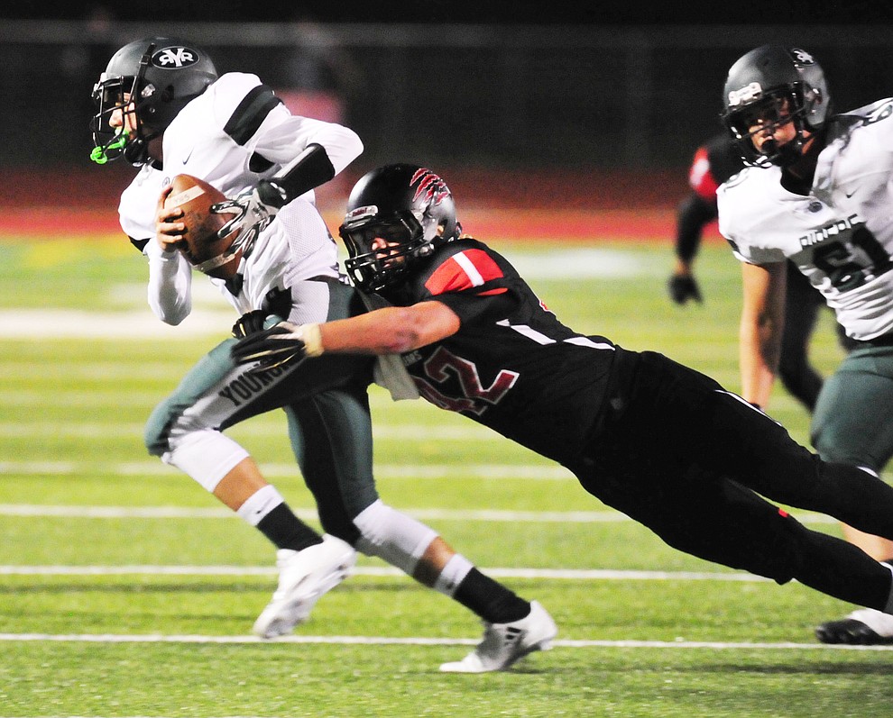 Bradshaw Mountain's Noah Shaver (42) gets the sack as the Bears take on the Youngker Roughriders in their home opener Friday, August 31, 2018 in Prescott Valley. (Les Stukenberg/Courier)