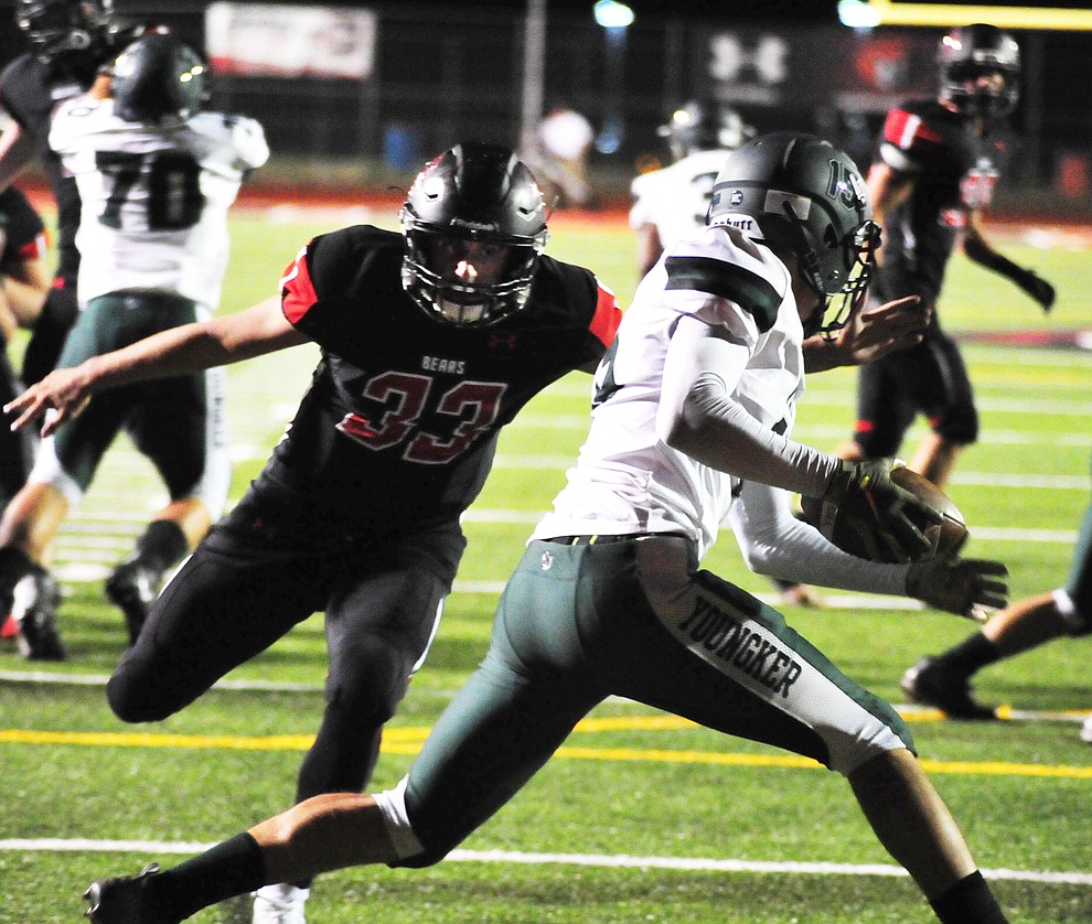 Bradshaw Mountain's Luke Huenemeyer (33) forces the punter to pull it down as the Bears take on the Youngker Roughriders in their home opener Friday, August 31, 2018 in Prescott Valley. (Les Stukenberg/Courier)