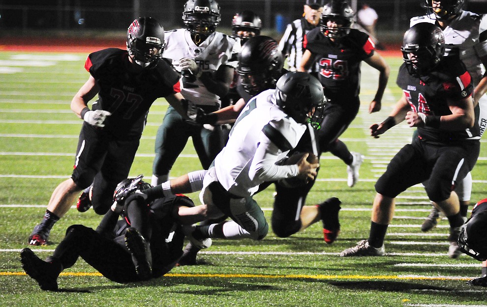 Bradshaw Mountain's Elijah Knisely (4) and the defense forces another loss as the Bears take on the Youngker Roughriders in their home opener Friday, August 31, 2018 in Prescott Valley. (Les Stukenberg/Courier)