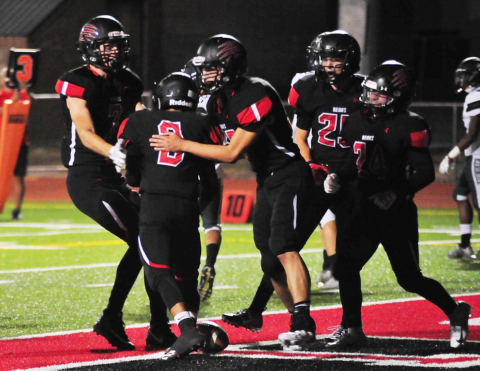 Bradshaw Mountain players celebrate Ruben Gonzalez' (3) touchdown as the Bears take on the Youngker Roughriders in their home opener Friday, August 31, 2018 in Prescott Valley. (Les Stukenberg/Courier)