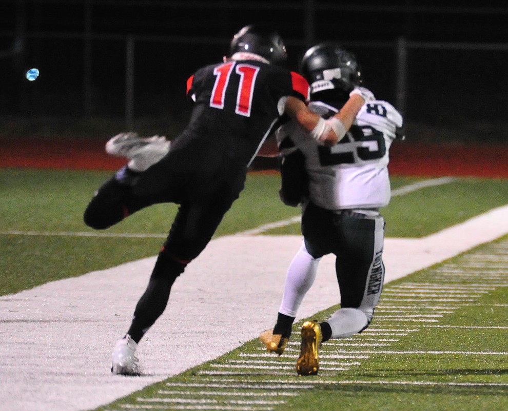 Bradshaw Mountain's Cody Tucker (11) makes a touchdown saving tackle as the Bears take on the Youngker Roughriders in their home opener Friday, August 31, 2018 in Prescott Valley. (Les Stukenberg/Courier)