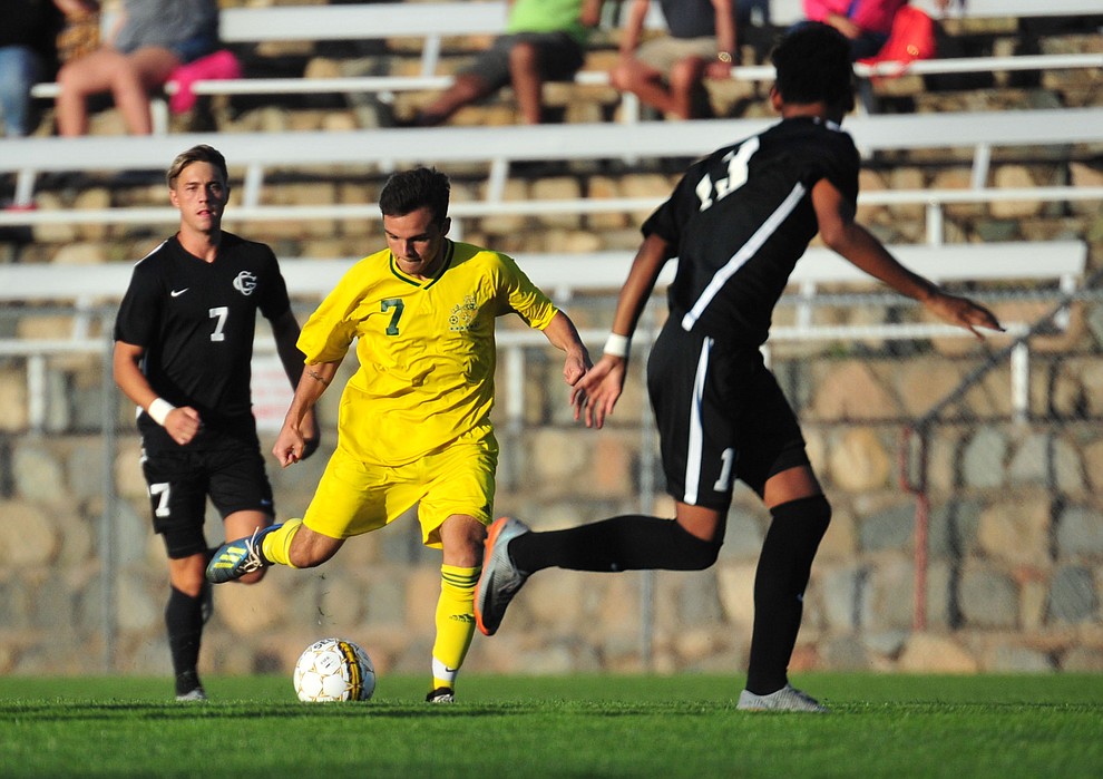 Yavapai's Esteban Franco sends a pass forward as the Roughriders take on Chandler/Gilbert in their home opener Saturday Sept. 1, 2018 in Prescott. (Les Stukenberg/Courier)