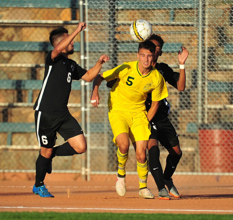 Yavapai's Gabriel Claudio heads the ball as the Roughriders take on Chandler/Gilbert in their home opener Saturday Sept. 1, 2018 in Prescott. (Les Stukenberg/Courier)