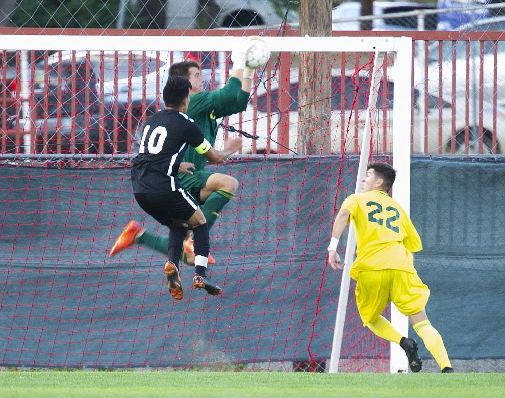 Yavapai's Tyler Trump makes a save as the Roughriders take on Chandler/Gilbert in their home opener Saturday Sept. 1, 2018 in Prescott. (Les Stukenberg/Courier)