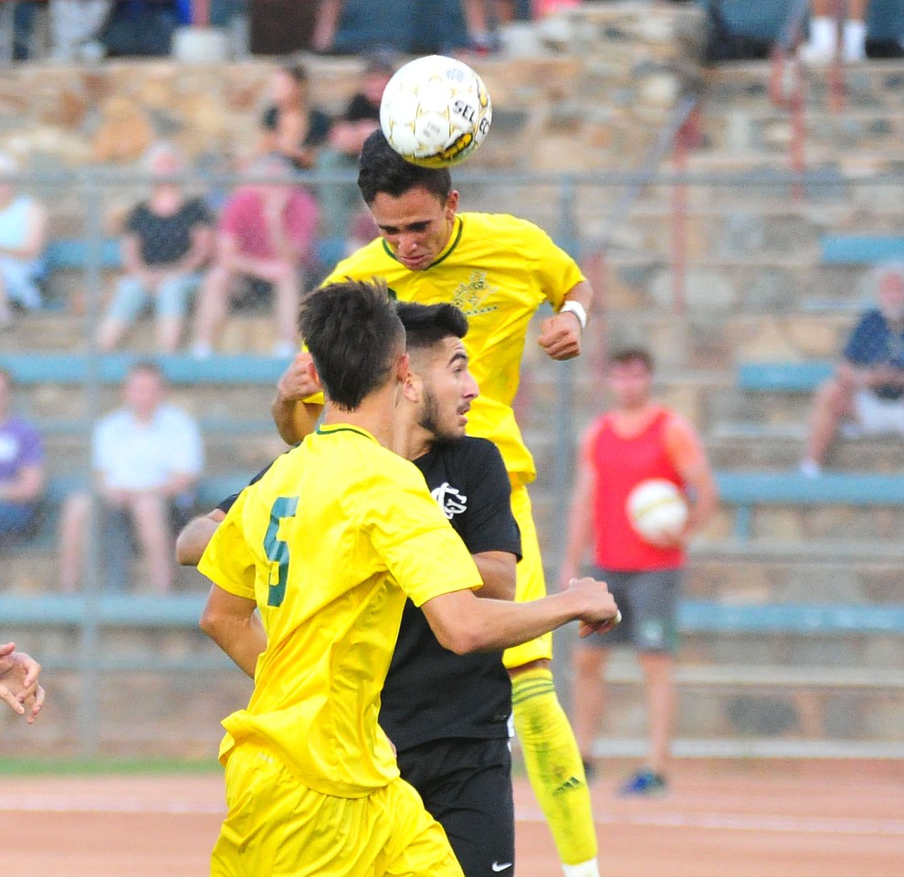 Yavapai's Brandon Fischer heads the ball off of a corner kick as the Roughriders take on Chandler/Gilbert in their home opener Saturday Sept. 1, 2018 in Prescott. (Les Stukenberg/Courier)