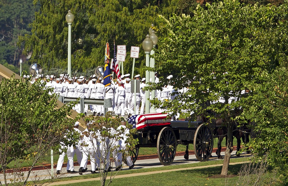A horse drawn caisson carries the casket containing the remains of Sen. John McCain, R-Ariz., to his burial sight at the United States Naval Academy Cemetery in Annapolis Md., Sunday, Sep. 2, 2018. McCain died Aug. 25 from brain cancer at age 81. (AP Photo/Jose Luis Magana)