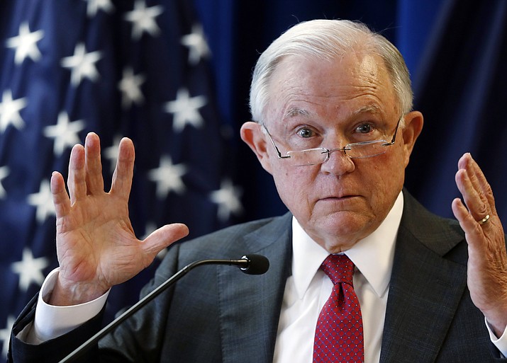In this July 13, 2018 photo, Attorney General Jeff Sessions delivers remarks in Portland, Maine. President Donald Trump is escalating his attacks on Attorney General Jeff Sessions, suggesting the embattled official should have intervened in investigations of two GOP congressmen to help Republicans in the midterms. Trump tweeted Monday that “investigations of two very popular Republican Congressmen were brought to a well publicized charge, just ahead of the Mid-Terms, by the Jeff Sessions Justice Department.” (Robert F. Bukaty/AP)