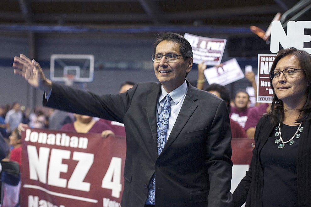 Navajo Nation presidential candidate Jonathan Nez arrives at the sports arena in the tribal capital surrounded by his supporters after winning a majority of the votes in the primary election Tuesday, Aug. 28, 2018, in Window Rock, Ariz. Current Navajo Nation Vice President Nez and former tribal President Joe Shirley Jr. are the top two finishers in Tuesday's primary election. They will face off in the November general election. (AP Photo/Cayla Nimmo)