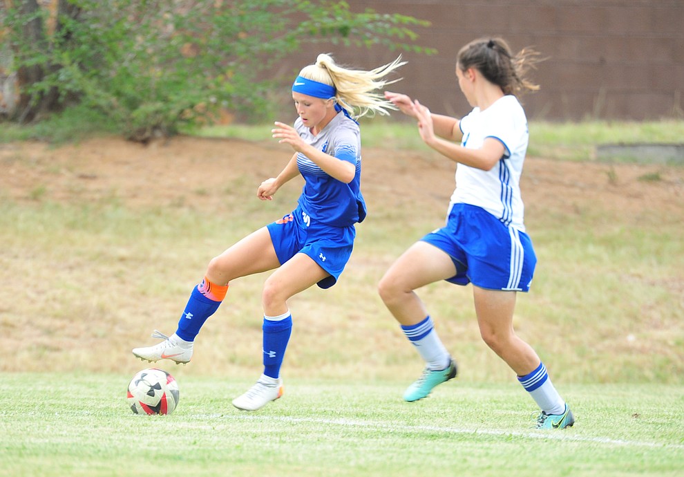 Chino Valley's Lauren Foster maneuvers the ball around a defender as the Cougars take on Snowflake at home Tuesday Sept. 4, 2018. (Les Stukenberg/Courier)