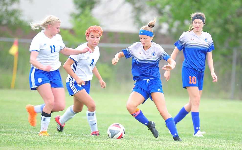 Chino Valley's Ashley McGuffey and Lindsey tenBerge control the ball in the center of the field as the Cougars take on Snowflake at home Tuesday Sept. 4, 2018. (Les Stukenberg/Courier)