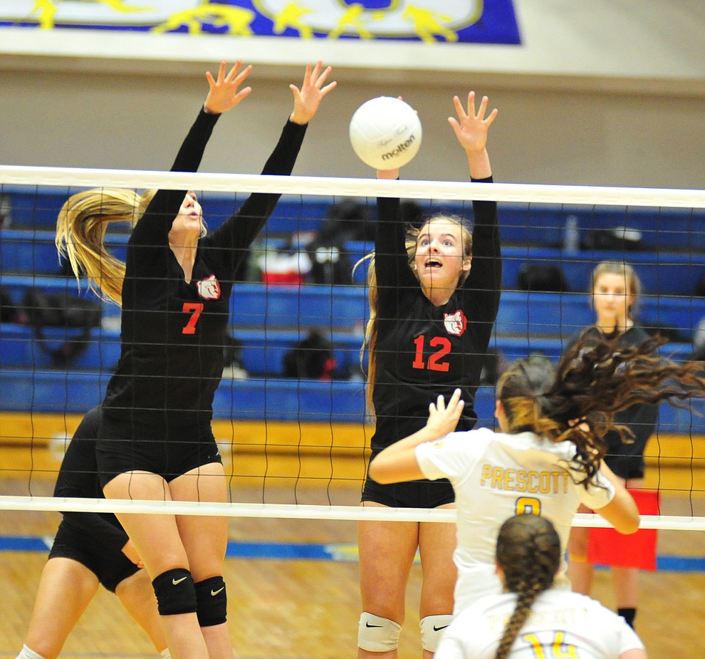 Bradshaw Mountain's Rylee Bundrick and Jordyn Moser go for a block as the Bears traveled to Prescott for a cross-town volleyball matchup against the Badgers Thursday Sept. 6, 2018. (Les Stukenberg/Courier)