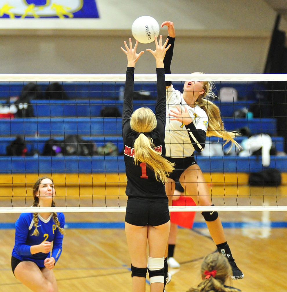 Prescott's Kathrine Radavich tries to slam through Shelbie Faughn as the Badgers hosted Bradshaw Mountain in a cross-town volleyball matchup Thursday Sept. 6, 2018. (Les Stukenberg/Courier)
