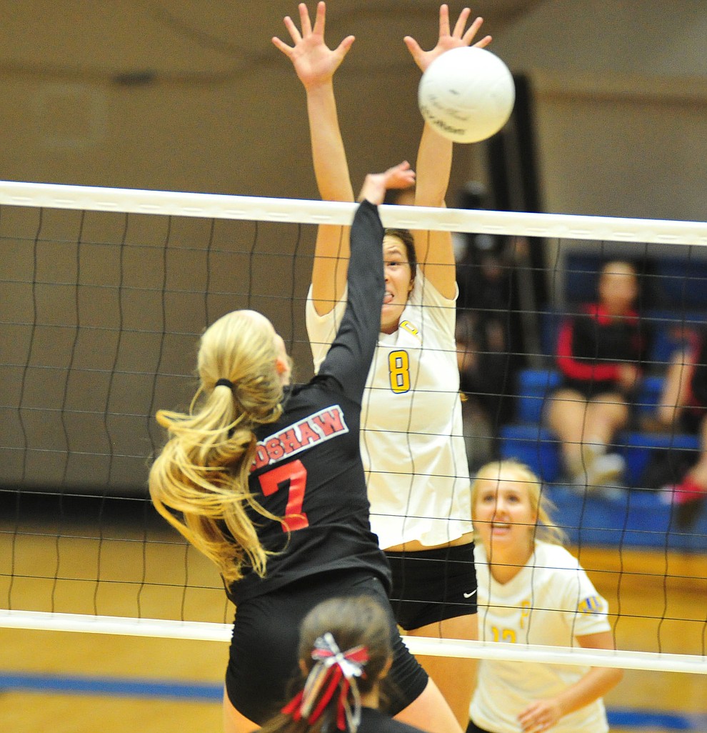 Prescott's Danielle Dreher gets high on Rylee Bundrick as the Badgers hosted Bradshaw Mountain in a cross-town volleyball matchup Thursday Sept. 6, 2018. (Les Stukenberg/Courier)