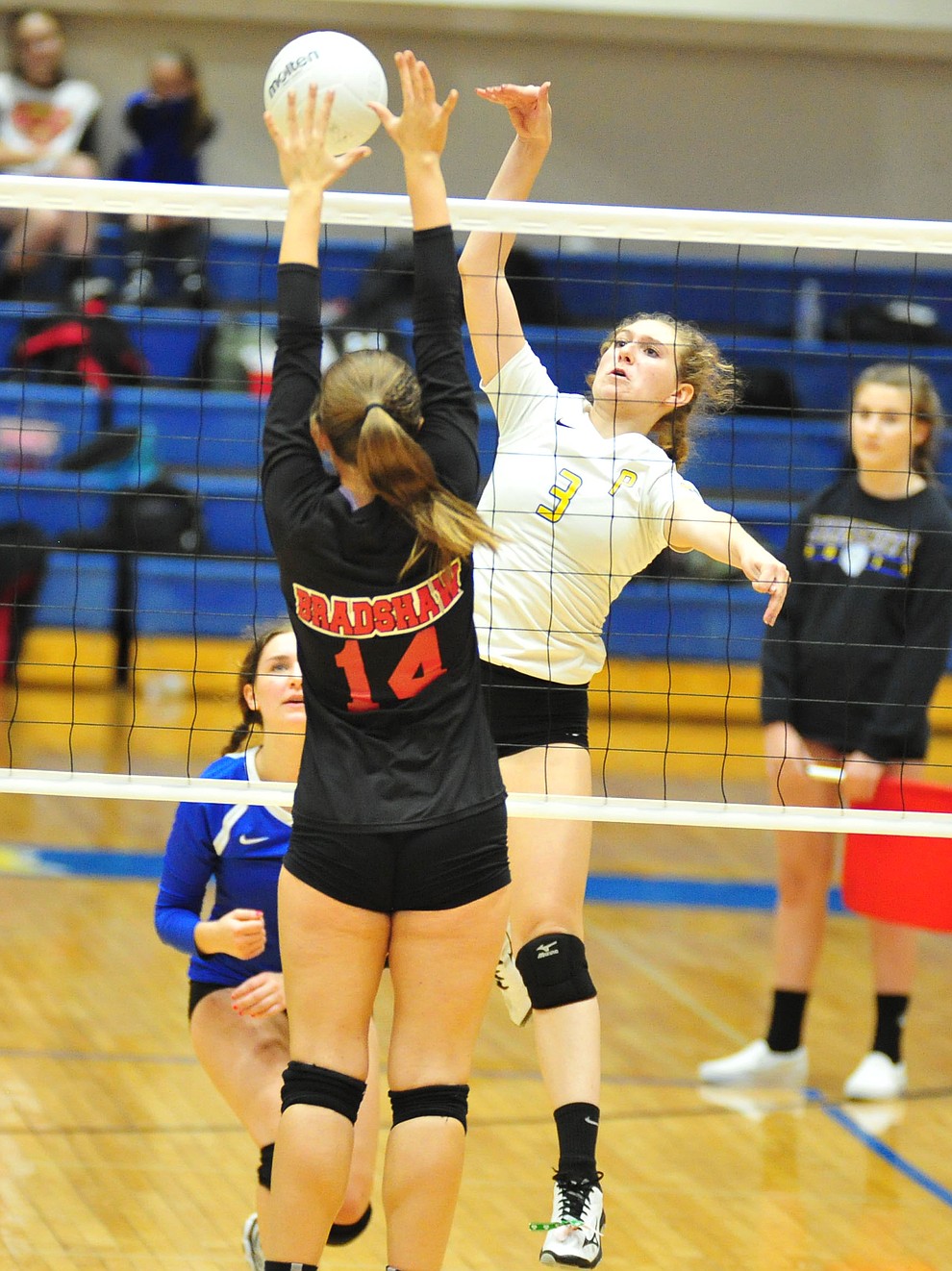 Prescott's Denali Skinner gets blocked by Courtnie Webb as the Badgers hosted Bradshaw Mountain in a cross-town volleyball matchup Thursday Sept. 6, 2018. (Les Stukenberg/Courier)