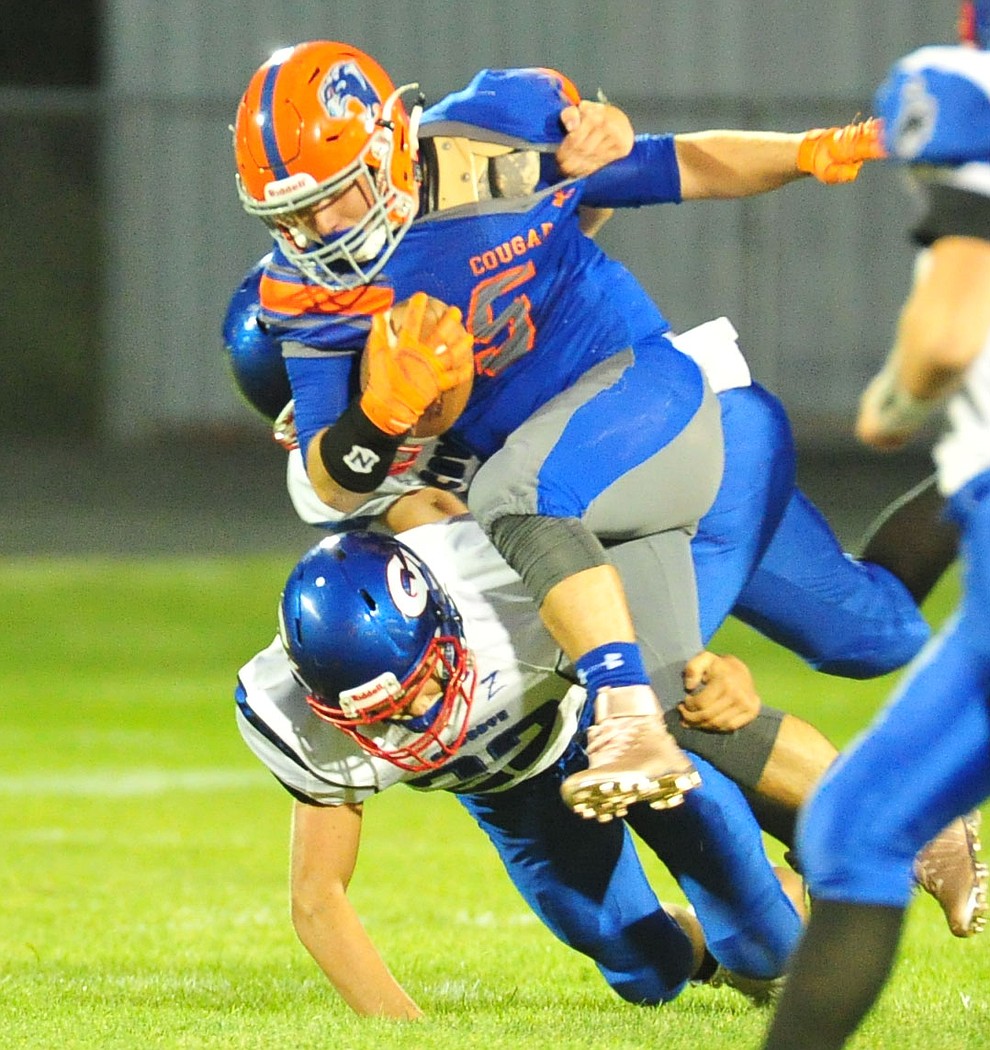 Chino Valley's Mikey Paulus runs hard as they host Camp Verde in the annual Copper Boot game Friday Sept. 7, 2018 in Chino Valley. (Les Stukenberg/Courier)