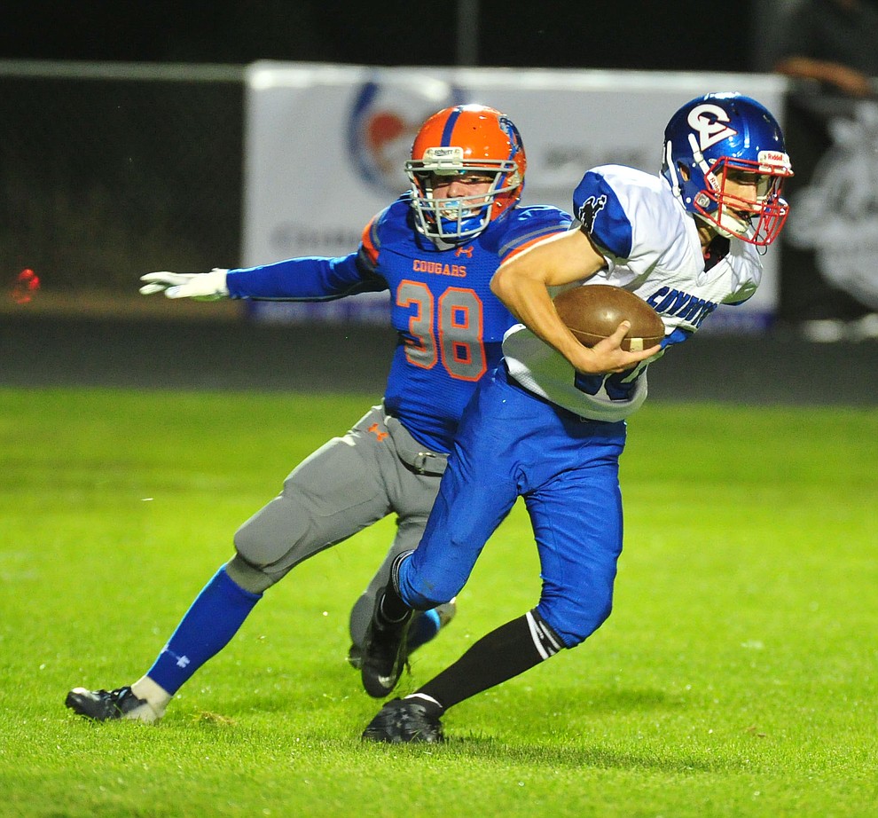 Chino Valley's Trevor Gianfrecesco puts pressure on Steven Petty as they host Camp Verde in the annual Copper Boot game Friday Sept. 7, 2018 in Chino Valley. (Les Stukenberg/Courier)