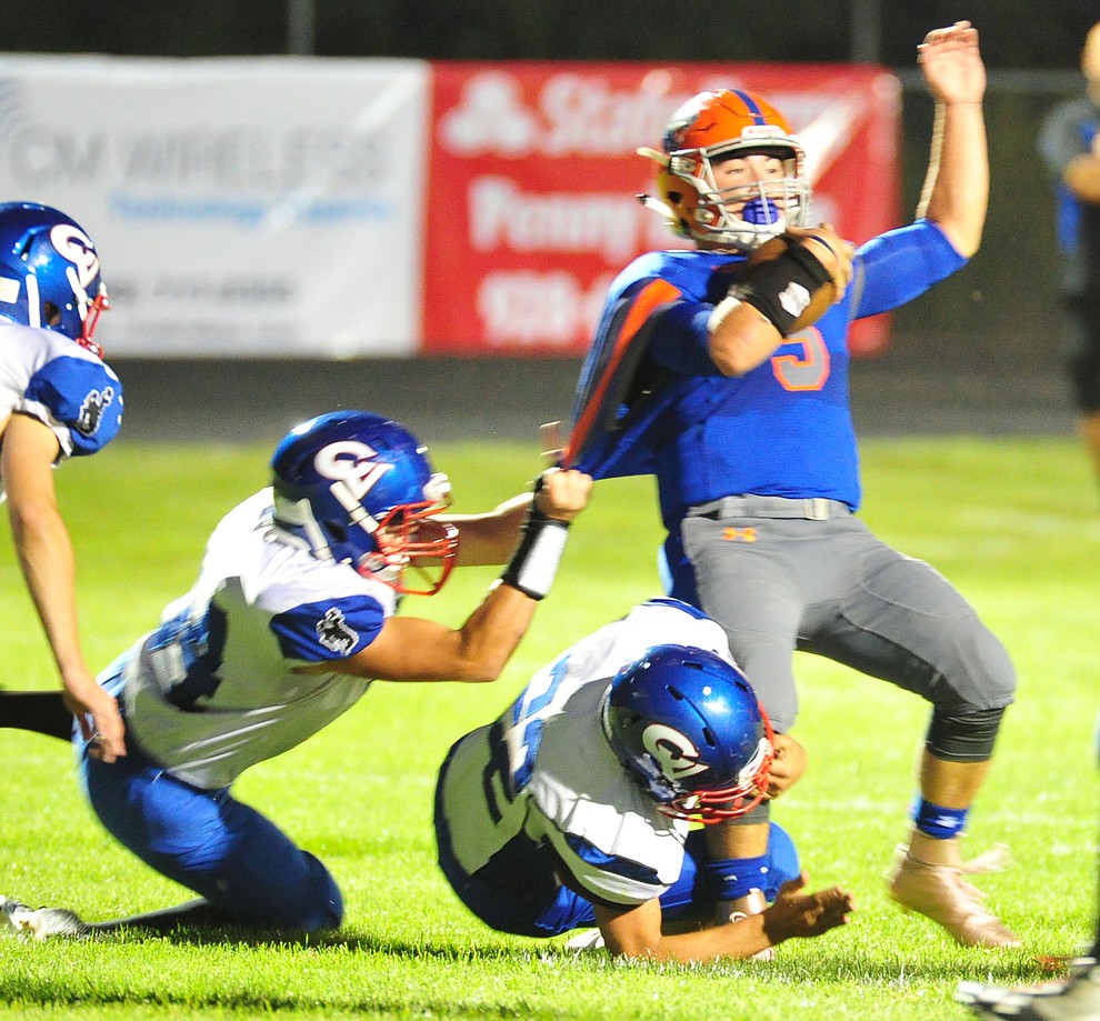 Chino Valley's Mikey Paulus gets hauled down as they host Camp Verde in the annual Copper Boot game Friday Sept. 7, 2018 in Chino Valley. (Les Stukenberg/Courier)