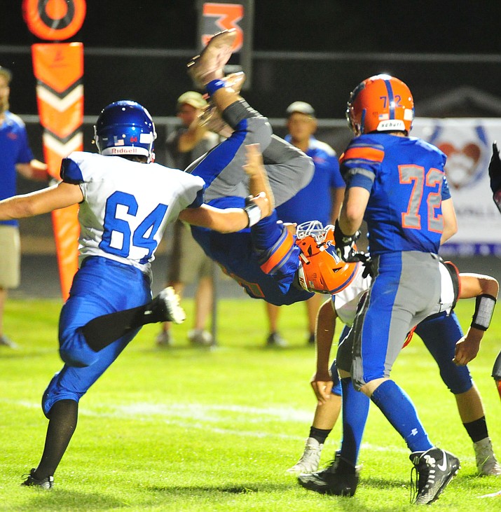 Chino Valley’s Mikey Paulus goes up and over for a touchdown, his second of the night, as the Cougars host Camp Verde in the annual Bronze Boot game Friday, Sept. 7, 2018, in Chino Valley. (Les Stukenberg/Courier)