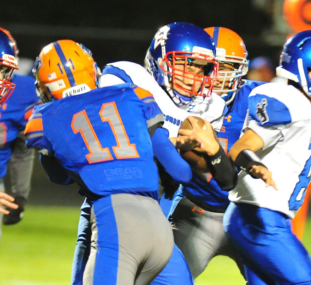 Camp Verde's Jacob Oothoudt runs into JR Willingham as they play Chino Valley in the annual Copper Boot game Friday Sept. 7, 2018 in Chino Valley. (Les Stukenberg/Courier)