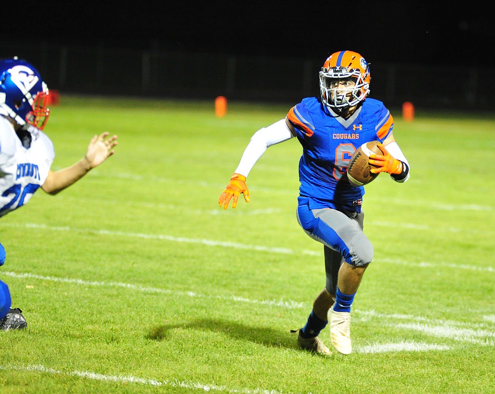 Chino Valley's Elijah Scordato runs for the sidelines and a touchdown as they host Camp Verde in the annual Copper Boot game Friday Sept. 7, 2018 in Chino Valley. (Les Stukenberg/Courier)