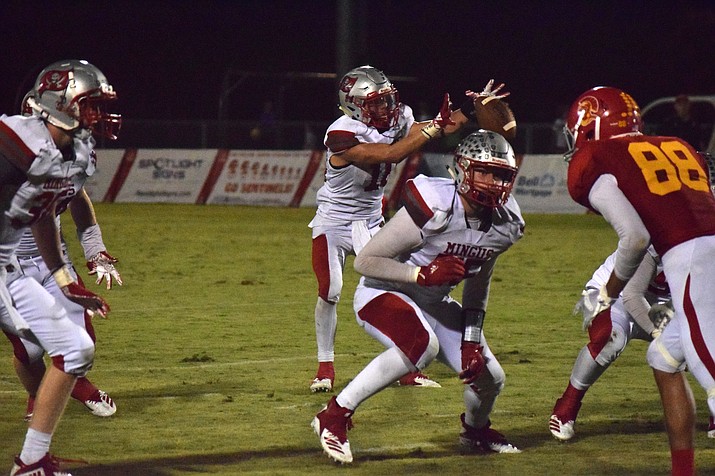 Mingus senior Alex Nelson receives a direct snap during the Marauders’ 36-26 loss at Chandler Seton Catholic Prep. Mingus Union used four players at quarterback in the defeat. VVN/James Kelley