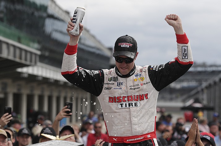 TOP: NASCAR Cup Series driver Brad Keselowski (2) celebrates after winning the NASCAR Brickyard 400 auto race at Indianapolis Motor Speedway, in Indianapolis Monday, Sept. 10, 2018. (Michael Conroy/AP Photo) 