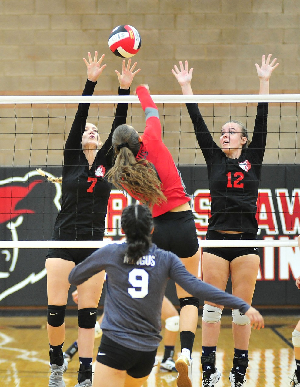 Bradshaw Mountain's Rylee Bundrick and Jordyn Moser go for a block as the Bears faced the Mingus Marauders in a volleyball matchup Tuesday, Sept. 11, 2018 in Prescott Valley. (Les Stukenberg/Courier)
