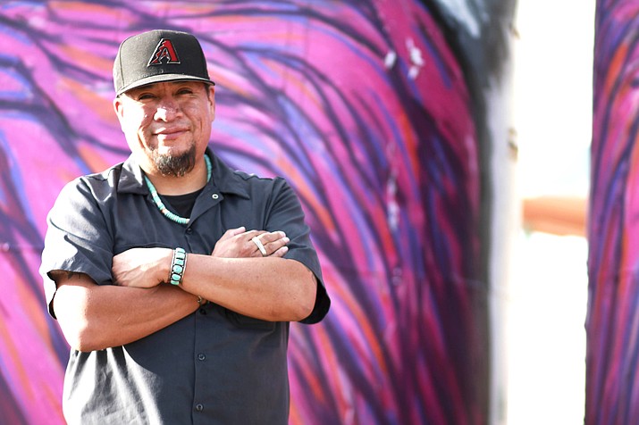 Jerrel Singer is a Native artist who paints murals in northern Arizona and along Highway 89 outside of Gray Mountain. The murals reflect some of the issues faced by the Navajo people and others including uranium mining. (Loretta Yerian/NHO)