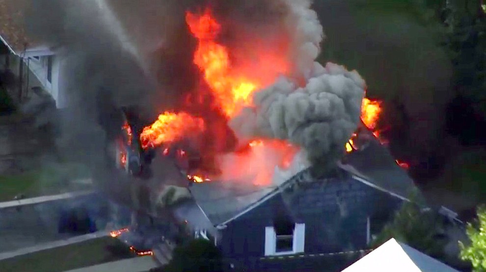 In this image take from video provided by WCVB in Boston, flames consume a home in Lawrence, Mass, a suburb of Boston, Thursday, Sept. 13, 2018. Emergency crews are responding to what they believe is a series of gas explosions that have damaged homes across three communities north of Boston. (WCVB via AP)