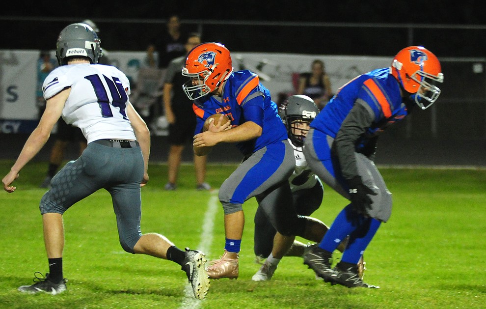 Chino Valley's Mikey Paulus breaks a long run in the first quarter as the Cougars host Arizona College Prep Friday, Sept. 14, 2018. (Les Stukenberg/Courier)