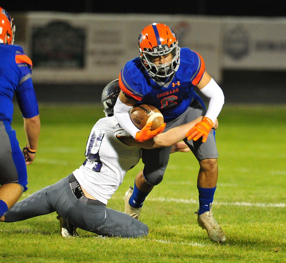 Chino Valley's Elijah Scordato tries for more yardage as the Cougars host Arizona College Prep Friday, Sept. 14, 2018. (Les Stukenberg/Courier)