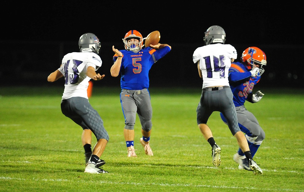 Chino Valley's Mikey Paulus delivers a touchdown pass as the Cougars host Arizona College Prep Friday, Sept. 14, 2018. (Les Stukenberg/Courier)