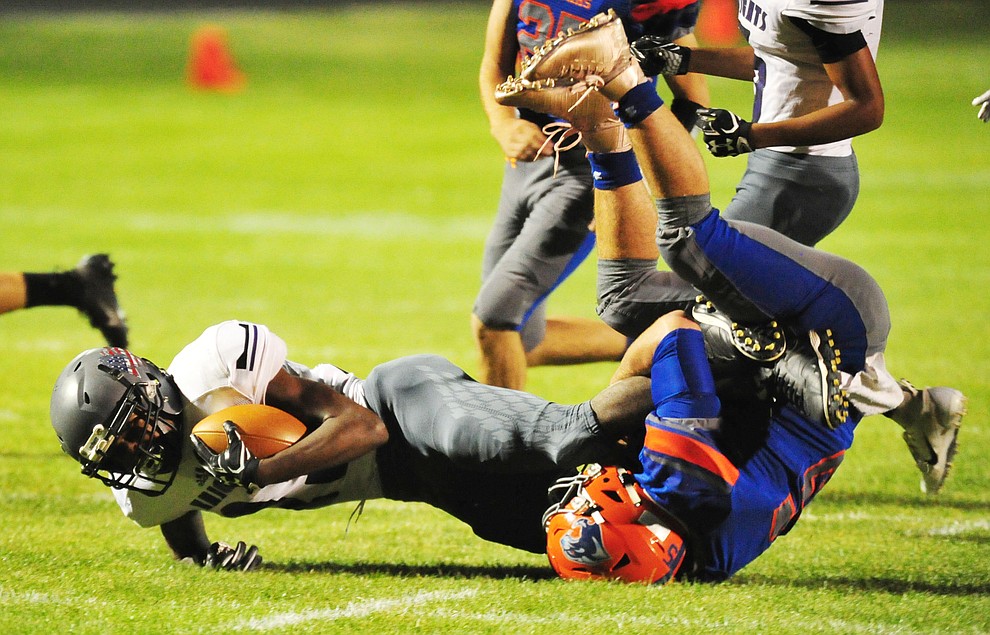 Chino Valley's Mikey Paulus makes a tackle as the Cougars host Arizona College Prep Friday, Sept. 14, 2018. (Les Stukenberg/Courier)